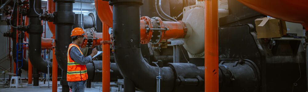 An engineer inspecting an industrial plant